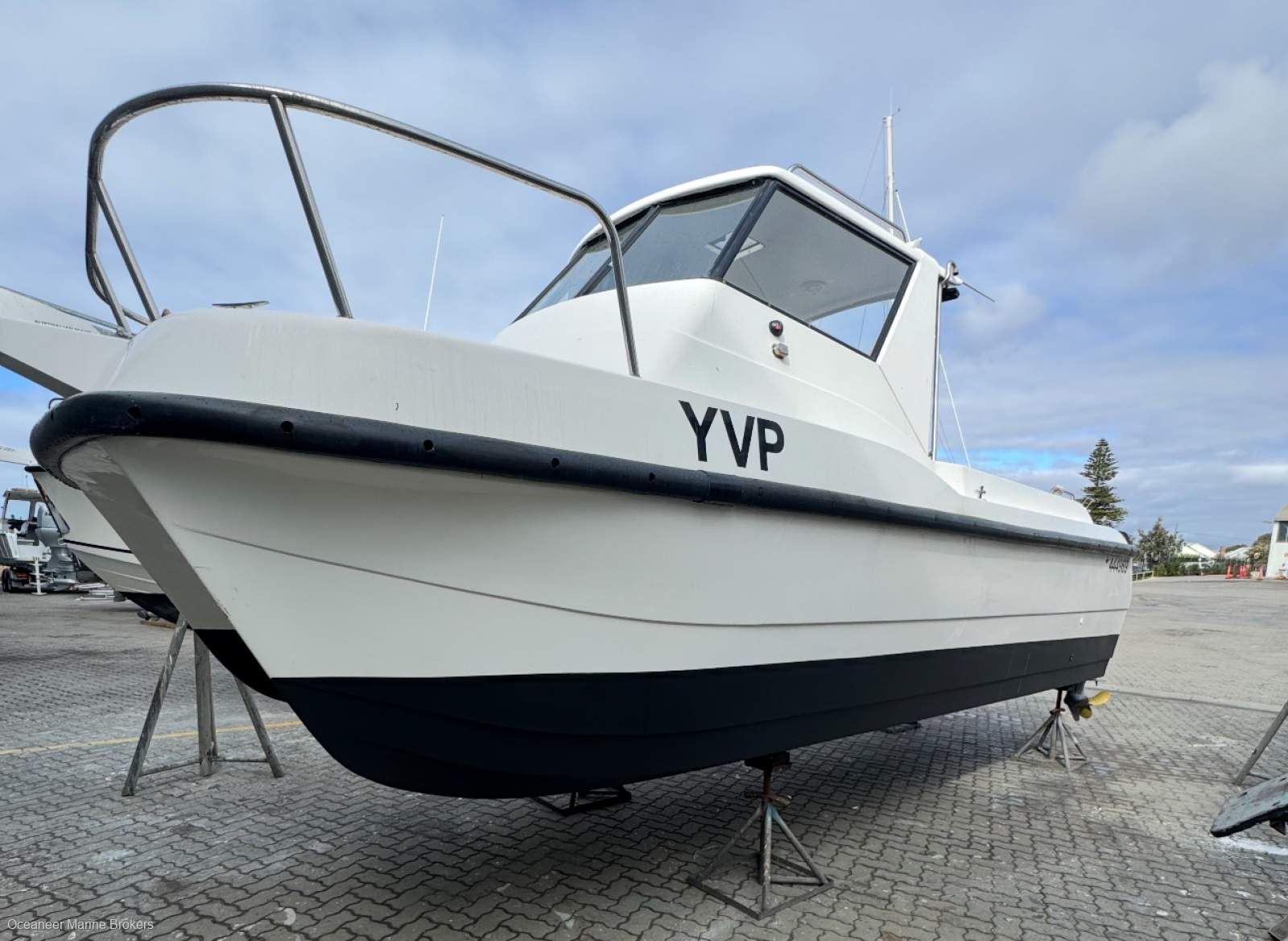 A 2007 Leisurecat 8000 sport fisher catamaran on stands in a boatyard